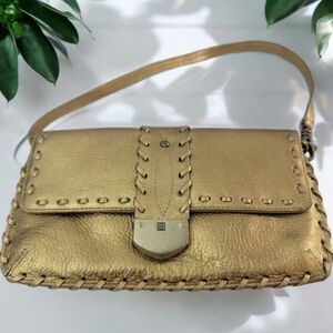 Michael Kors evening purse. Dementions are 8.5" L x 5" W 15" strap.